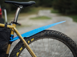 Blue rollable bicycle rear fender made of recycled plastic on a gravel bike
